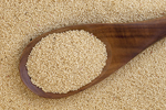 amaranth grain on a wooden spoon