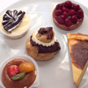 five desserts on a white plate