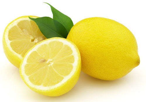 one whole lemon, two half lemons and two leaves