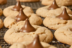 peanut butter blossom cookies cooling on a wire rack