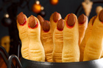 ten witches fingers cookies standing upright in a black kettle